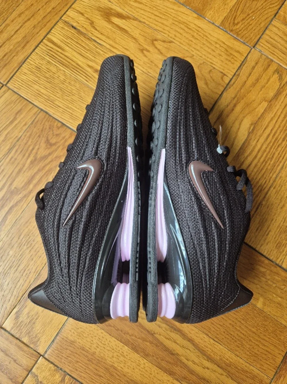 Nike Women’s Black Sneakers with Rose Metallic Swoosh